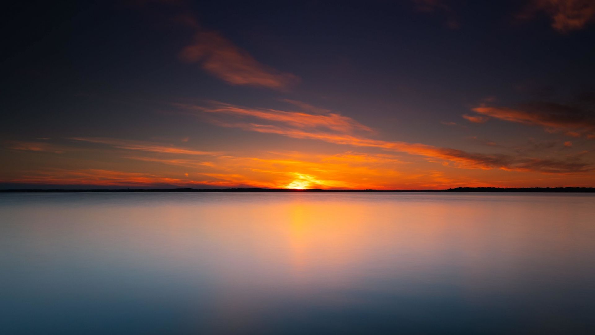 A Calm Lake At Sunset Wallpapers